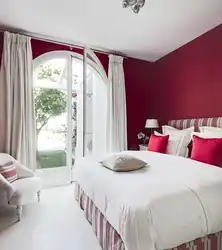 Photo of a bedroom in burgundy tones photo