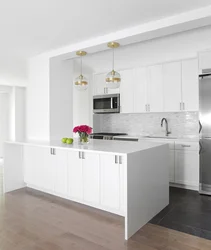 Kitchens with white countertops and white sink photo