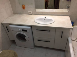 Bathroom countertop with washing machine photo