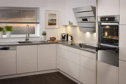 Corner kitchen design with refrigerator, household appliances photo