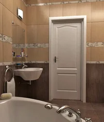 Doors to the bathroom and toilet in the interior photo