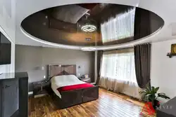 Two-level suspended ceilings with lighting in the bedroom photo design
