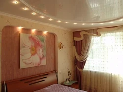 Two-level suspended ceilings with lighting in the bedroom photo design