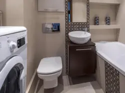 Bathroom with sink, toilet and washing machine photo