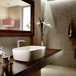 Bathroom design with countertop sink photo