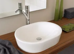 Bathroom design with countertop sink photo