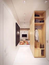 Interior of a narrow hallway with a shoe rack