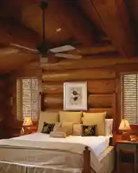 Bedroom interior of a wooden house made of logs