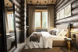 Bedroom interior of a wooden house made of logs