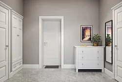 White doors in the interior of an apartment with floors