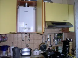 Kitchen with corner stove and gas water heater photo