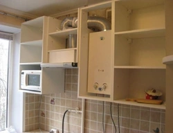 Kitchen with corner stove and gas water heater photo