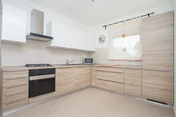 Modern White Kitchen With Wood In The Interior