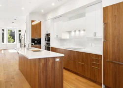 Modern white kitchen with wood in the interior