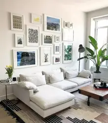 Decorating the wall above the sofa in the living room with your own photos