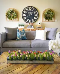 Decorating the wall above the sofa in the living room with your own photos
