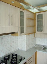 Photo of a kitchen with a ventilation duct in the corner photo