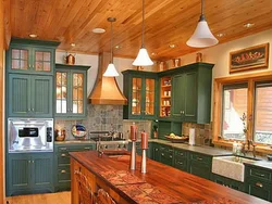 Kitchens on one wall in a wooden house photo