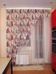 Curtains for the kitchen in the interior of the apartment