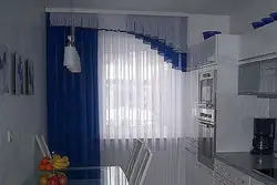 Одна штора на кухне в интерьере