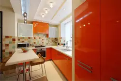 Color combination with orange in the kitchen interior photo