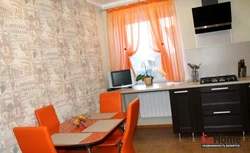 Color combination with orange in the kitchen interior photo