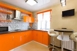 Color combination with orange in the kitchen interior photo