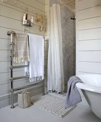 Heated towel rail in the bathroom interior