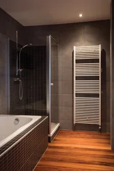 Heated towel rail in the bathroom interior