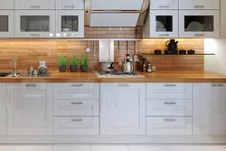 Wallpaper in the interior of a white kitchen with wood