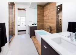 Bath design with marble tiles and wood