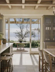 Kitchen design in a country house with access to the terrace