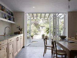 Kitchen design in a country house with access to the terrace