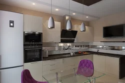 Photo of a kitchen with a TV set