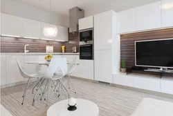 Photo of a kitchen with a TV set