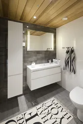 Gray bathroom with wood photo