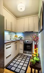 Photo of a small corner kitchen with appliances