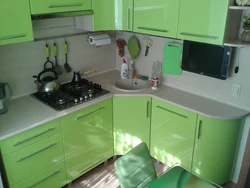 Photo of a small corner kitchen with appliances