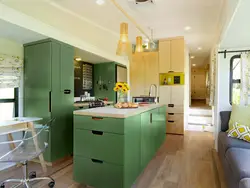 Green kitchen with wood kitchen interior