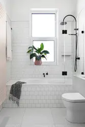 Bathtub finishing with white tiles photo