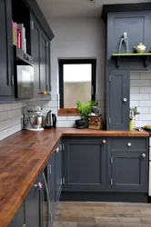 Light gray kitchen with wooden countertop photo