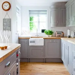 Light gray kitchen with wooden countertop photo