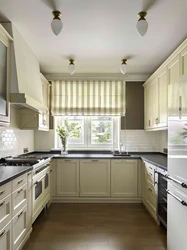 Interior of a rectangular kitchen with one window photo