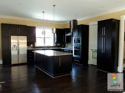 Kitchen photo with dark floor photo