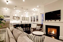 Kitchen design living room with fireplace in the house photo