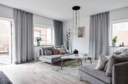 Gray curtains in the living room interior photo