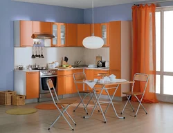 Gray wallpaper and orange kitchen photo