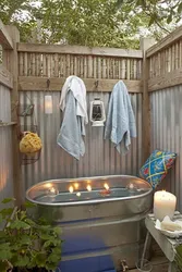 Bathtub in a summer cottage photo