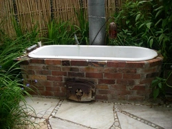 Bathtub in a summer cottage photo