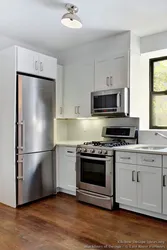 Refrigerator in the middle of the kitchen photo